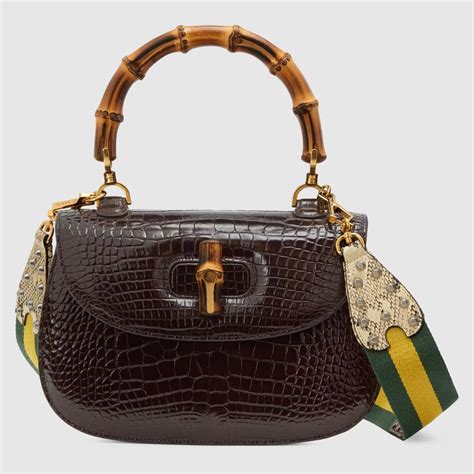 gucci peggy coated drawstring with bamnoo tassel shoulder bag|Gucci bamboo bag 1947.